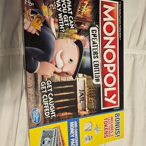 Hasbro Monopoly Cheaters Edition - Black, Red, and Yellow